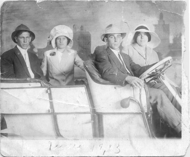 Antonio Pacheco, Georgina (Medeiros) Pacheco, Anton "Dean" Souza, and Angelina (Vierra) Pacheco in studio photo in car ca 1915